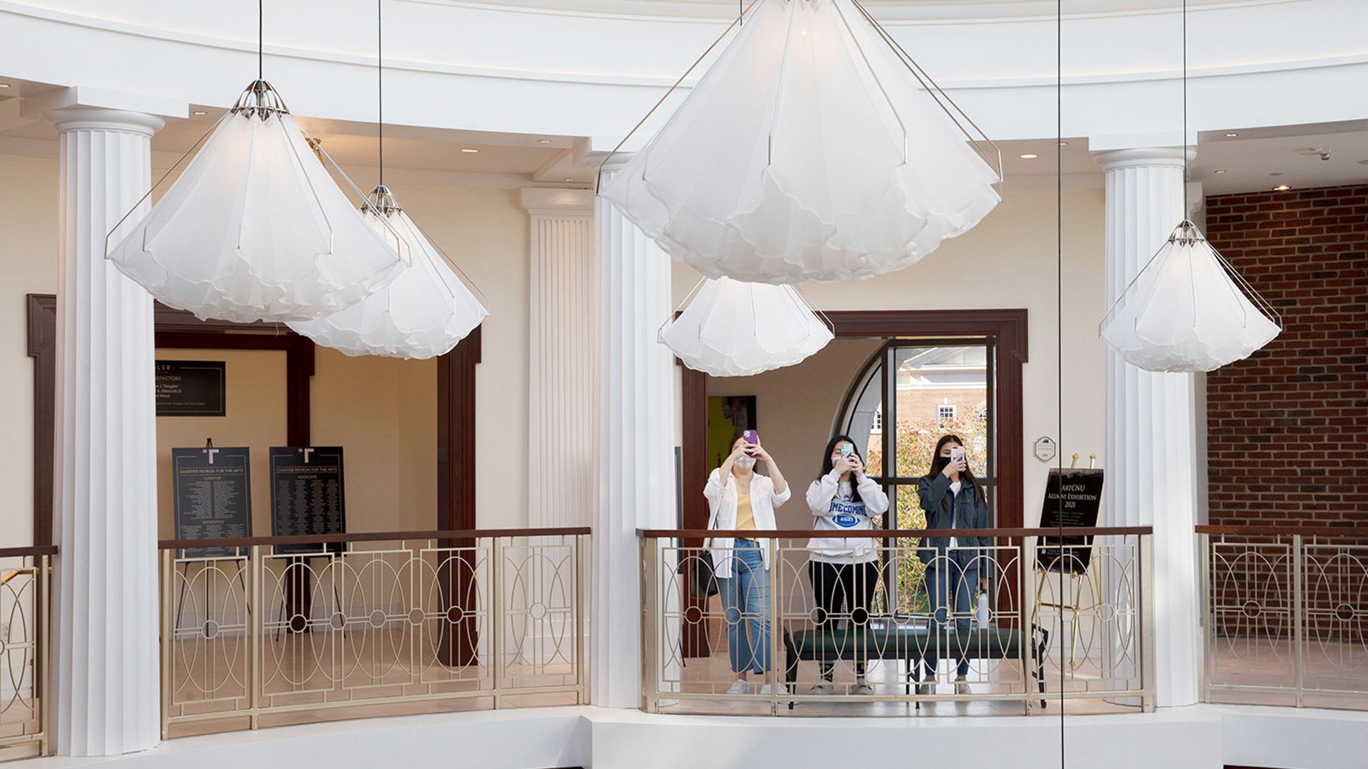 Students taking pictures of the Shylight installation