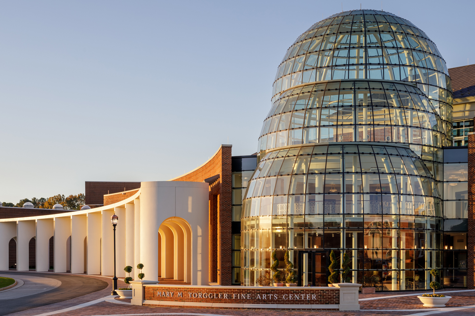 Exterior of the Mary M. Torggler Fine Arts Center at sunset