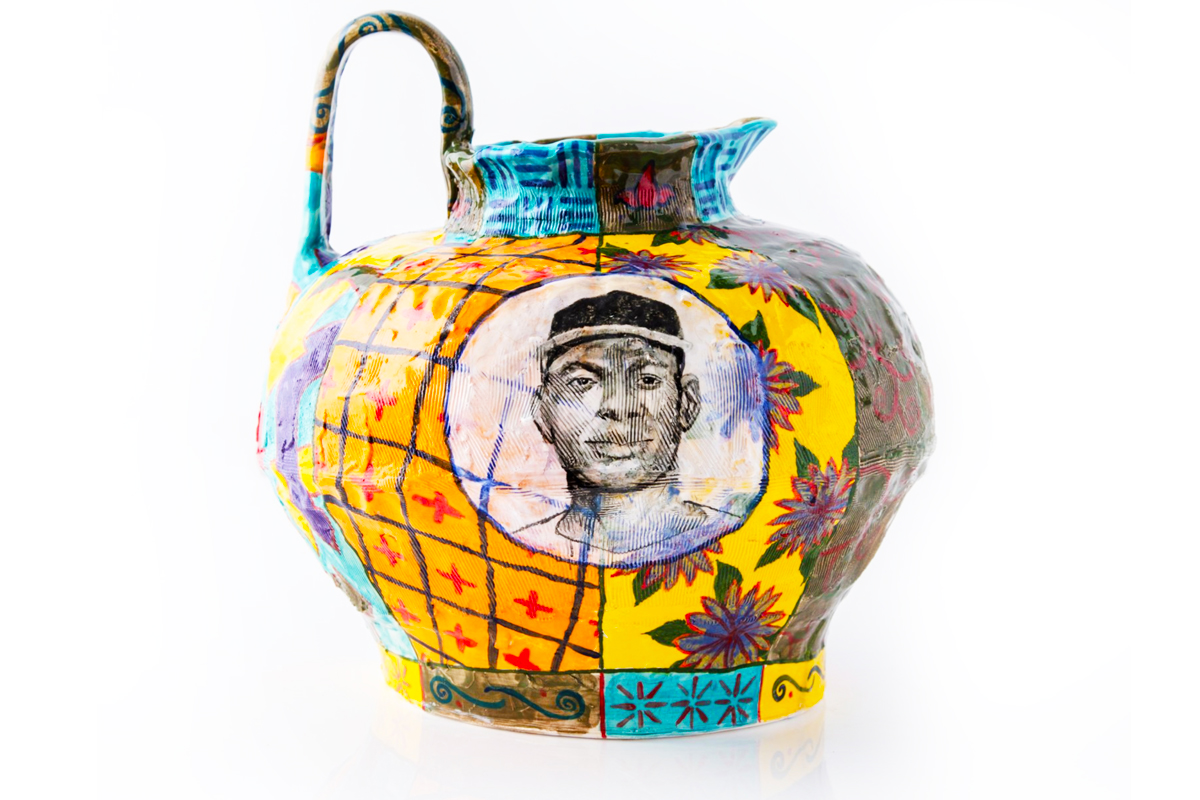 Multi colored ceramic pitcher with portrait of satchel paige