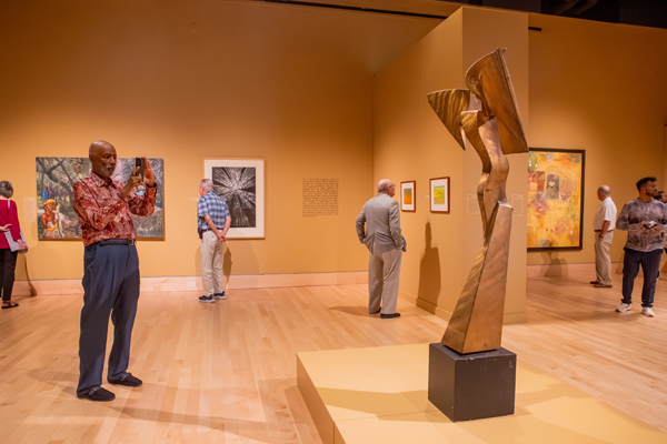 Patrons enjoy an exhibition in the Anne Noland Edwards Gallery, 