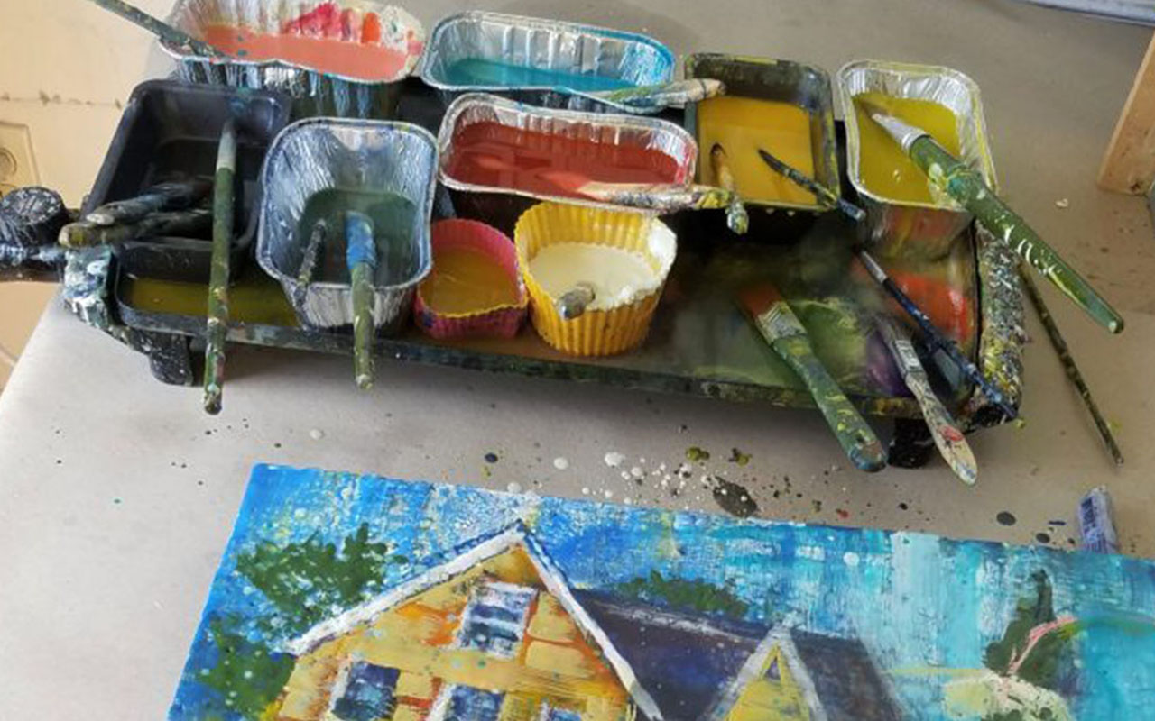 Watercolor paint and paintbrushes