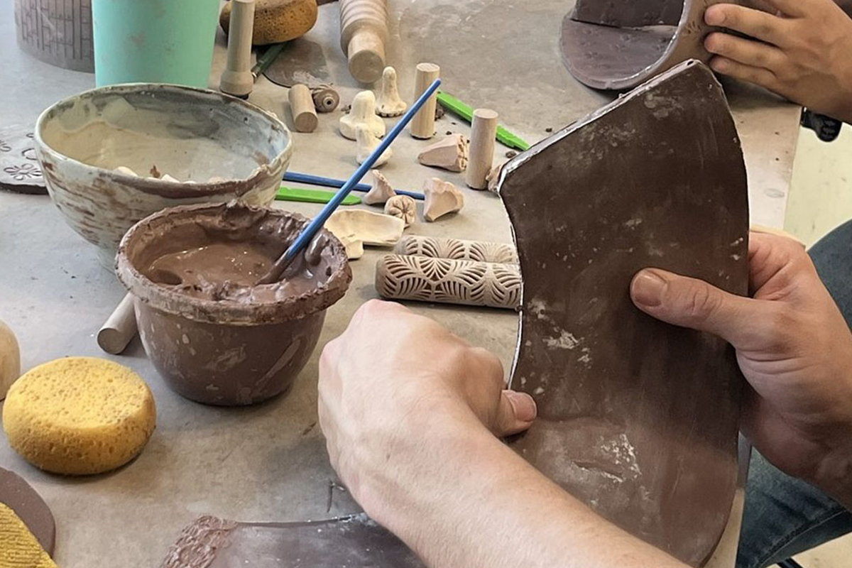 Using sculpting tools on clay