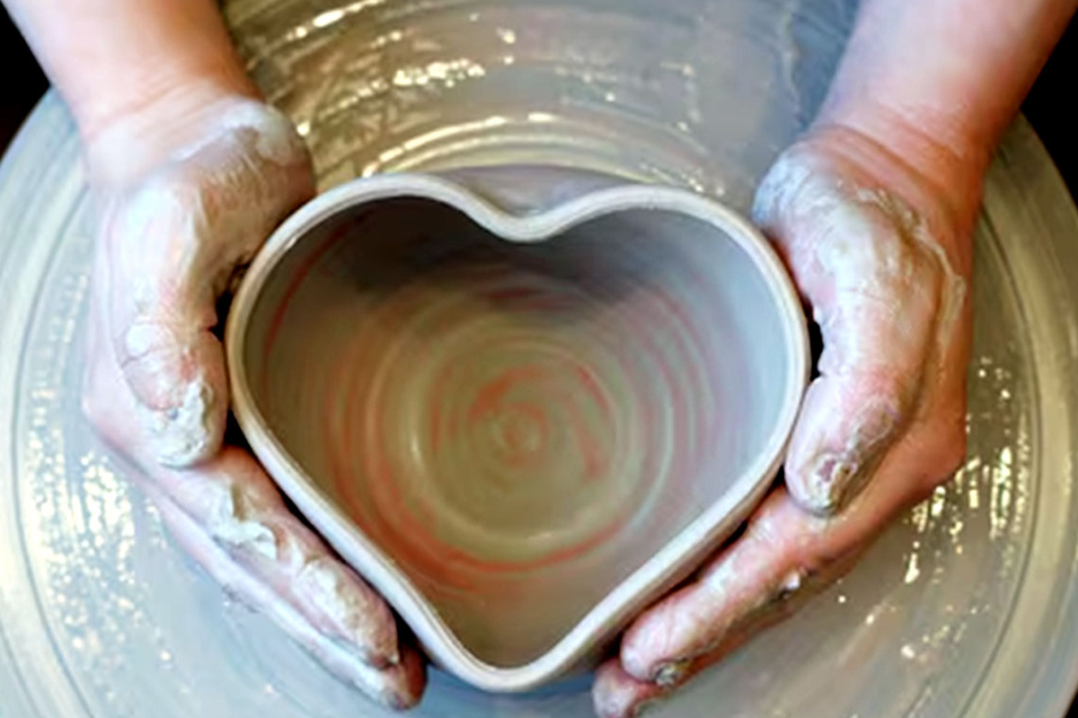 A heart shaped clay pot taking form