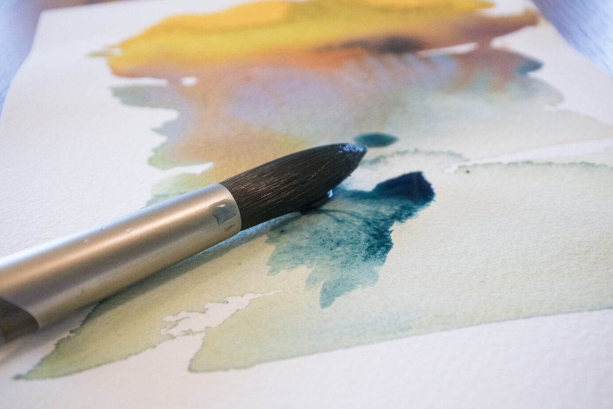 Watercolor paint and paintbrushes